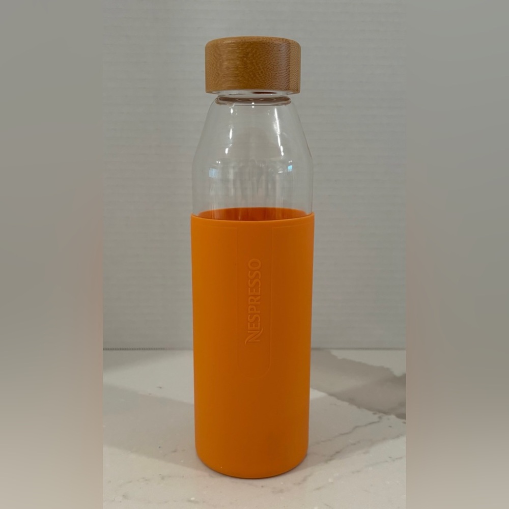 Nespresso Limited Edition Clear Glass Bottle, Orange Silicone Sleeve, Bamboo Lid